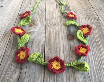 crocheted flower wreath to tie for flower children, flowers dark red