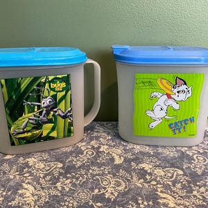 Set of 2 Vintage Tupperware Pitchers, Disney It’s A Bugs Life and 101 Dalmatians.