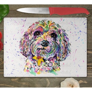 May include: A colorful watercolor painting of a small dog with a yellow flower on its collar. The painting is on a white background with colorful paint splatters.