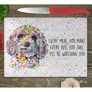 May include: A colorful watercolor painting of a dog with the text "Every meal you make, every bite you take, I'll be watching you." The background is white with colorful splatters.
