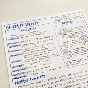 May include: Handwritten notes on a blue and white lined page with the title "Chapter Review: Key Words" and a table listing terms related to cell division, including mitosis, cytokinesis, chromatid, centromere, centrioles, spindle, prophase, metaphase, anaphase, and telophase. The page also includes a section titled "Chapter Summary" and a section titled "Graphics" with illustrations of the different phases of cell division.