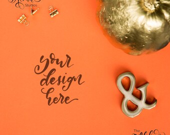 Halloween flatlay / Orange background and golden pumpkin mockup / Golden ampersand background