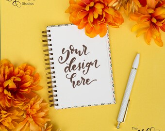 Autumn colors flatlay / Square lettering mockup with orange flowers / White journal / Fall themed background