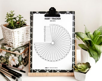May include: A black and white printable habit tracker with a circular design. The tracker is divided into 12 months and 365 days. The text "HABIT TRACKER 365 DAYS" is at the top of the page.