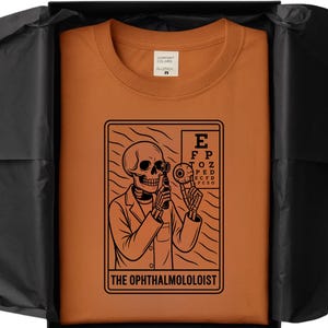 Tarot Card Skeleton Ophthalmologist TShirt Spooky Season Funny Eye Doctor Graphic Tee for Optometrists Eye Care Lovers Halloween Gifts