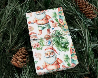 May include: A wrapped gift with a tropical Christmas theme. The wrapping paper features Santa Claus in swim trunks, seashells, and tropical flowers. The gift is tied with twine and rests on a bed of pine needles and pine cones.
