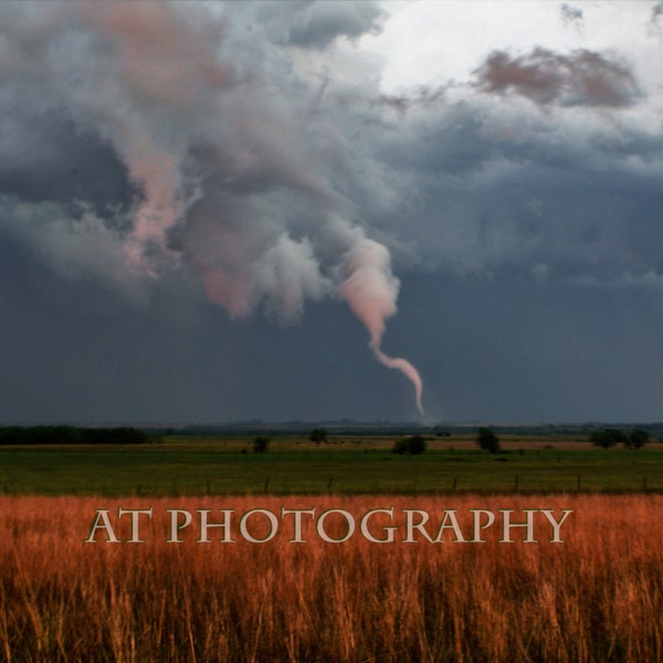 A Rope Tornado forms on the Kansas Prairie from a Rainy Day Storm Cloud into this Tornado on the Kansas Prairie in the Flint Hills of Kansas