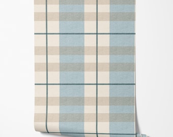 May include: A roll of wallpaper featuring a plaid pattern in shades of beige, light blue, and gray. The design includes vertical and horizontal lines creating a grid-like appearance. The wallpaper is partially unrolled, revealing the pattern.