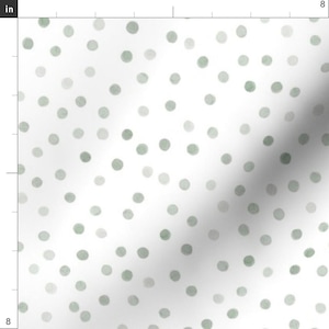 May include: White fabric with a repeating pattern of soft green and gray polka dots. The dots vary in size and shade, creating a watercolor effect. The design is simple and elegant, suitable for various craft projects.