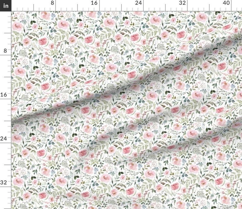 May include: White fabric with a watercolor floral pattern. The design features pink roses, blue accents, and green foliage. The pattern is repeated across the fabric, creating a delicate and romantic aesthetic.