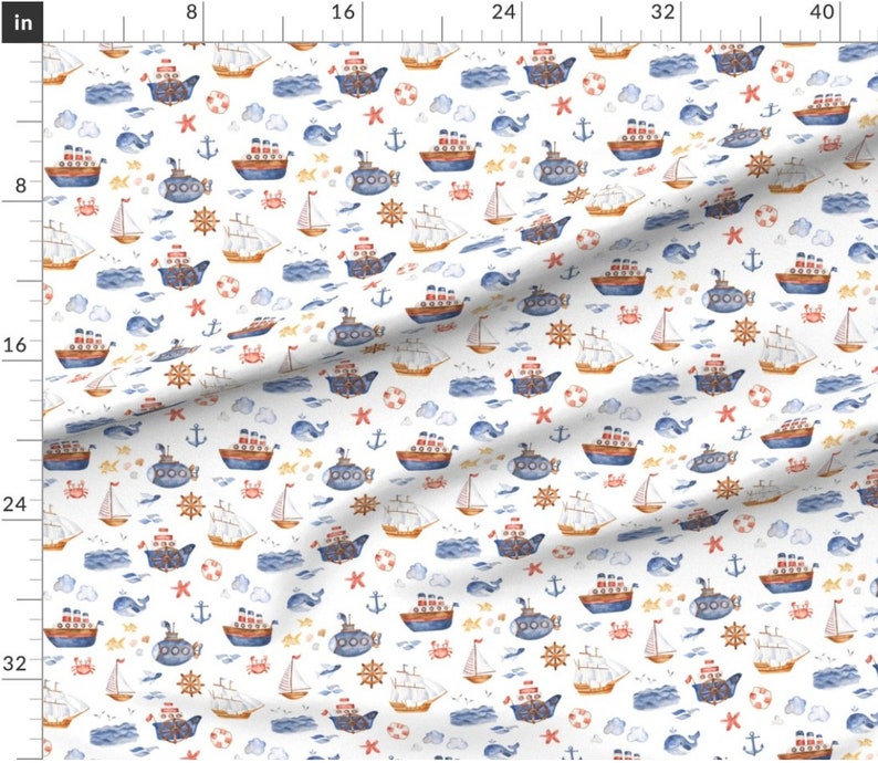 May include: A white fabric with a repeating pattern of watercolor illustrations of blue and red sailboats, yellow anchors, red starfish, blue whales, brown crabs, and yellow life preservers. The pattern is on a white background.