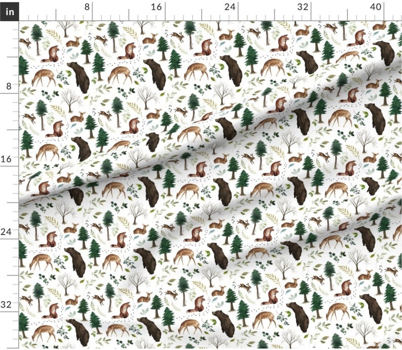 May include: A white fabric with a repeating pattern of brown bears, deer, and pine trees. The pattern is set against a white background with green leaves and brown branches.