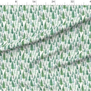 May include: A white fabric with a repeating pattern of green, blue, and black watercolor pine trees.