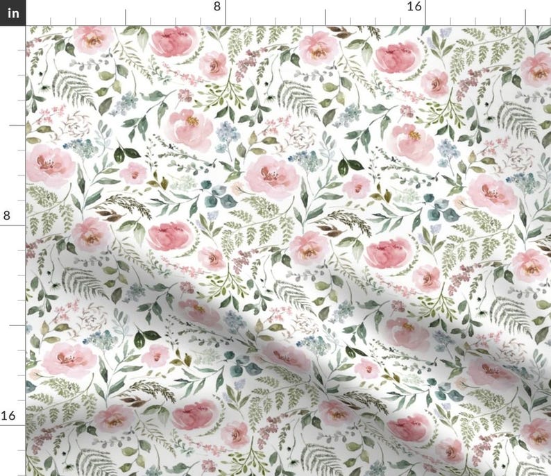 May include: White fabric with a watercolor floral pattern. The design features pink roses, green leaves, and small blue flowers. The pattern is dense and covers the entire surface, creating a romantic and natural aesthetic.