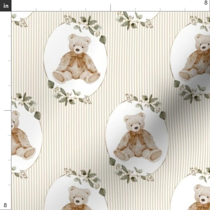 May include: Cream-colored fabric with a repeating pattern of teddy bears in oval frames. Each bear has a brown bow and is surrounded by a floral wreath. The background features vertical beige stripes.