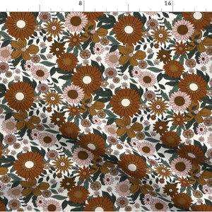 May include: A white fabric with a repeating pattern of brown, orange, and pink flowers. The flowers are stylized and have a retro 70s vibe.