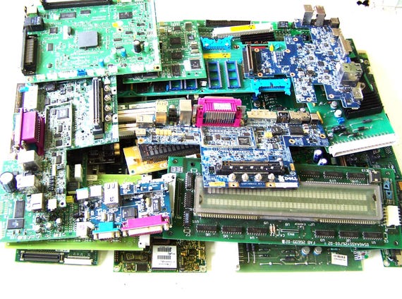 Upcycled real circuit boards repurposed into assemblage art/parts — genuinely salvaged tech with that 'made by a human who loves old computers' energy.