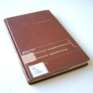 May include: A brown hardcover book titled "Micro Experiments in General Chemistry" by W. Bernard King. The book has a price tag of $4.02 and a date of 1955.