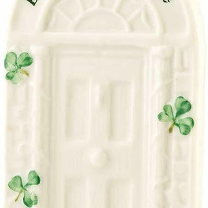 May include: White ceramic ornament with a green shamrock design. The ornament features a door with a shamrock design and the text "Bless this house".