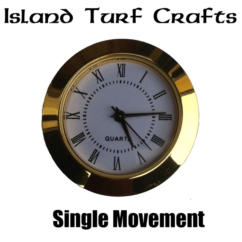 May include: Gold-toned clock face with Roman numeral hour markers and black hands. The clock face reads "QUARTZ".