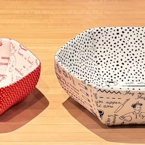 May include: Five fabric bowls in various sizes and patterns. The bowls are red, white, and black with floral and geometric designs.
