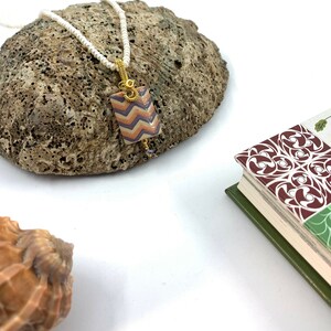 Hand painted chevron pendant, porcelain jewelry, ceramic jewelry, geometric jewelry, Global Curiosity, orange and purple, wire wrapping