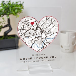 May include: A clear acrylic plaque with a red heart-shaped outline of a city map. The map shows streets and a river. A red heart is placed on the map. The text "02.08.2008 WHERE I FOUND YOU THE LACE MARKET NOTTINGHAM" is printed below the map.