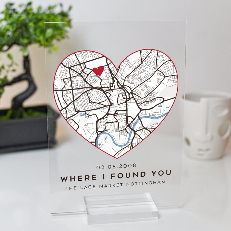 May include: A clear acrylic plaque with a red heart-shaped outline of a city map. The map shows streets and a river. A red heart is placed on the map. The text "02.08.2008 WHERE I FOUND YOU THE LACE MARKET NOTTINGHAM" is printed below the map.