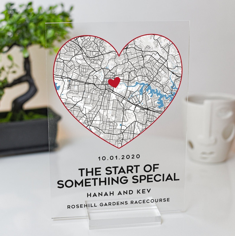 May include: A clear acrylic plaque with a red heart-shaped map of Rosehill Gardens Racecourse, Sydney, Australia. The date 10.01.2020 is printed below the map, along with the text "The start of something special, Hannah and Kev".