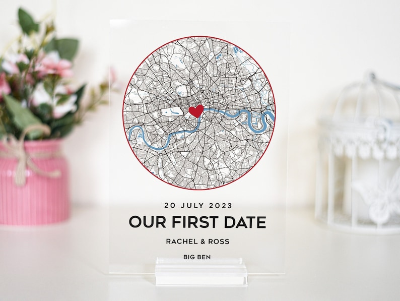 May include: A clear acrylic plaque with a map of London, a red heart marking a location, and the text "20 July 2023 Our First Date Rachel & Ross Big Ben".