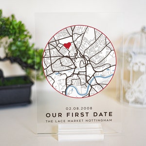 May include: A clear acrylic sign with a map of Nottingham, England, featuring a red heart marking a location. The text "02.08.2008 OUR FIRST DATE THE LACE MARKET NOTTINGHAM" is printed below the map.