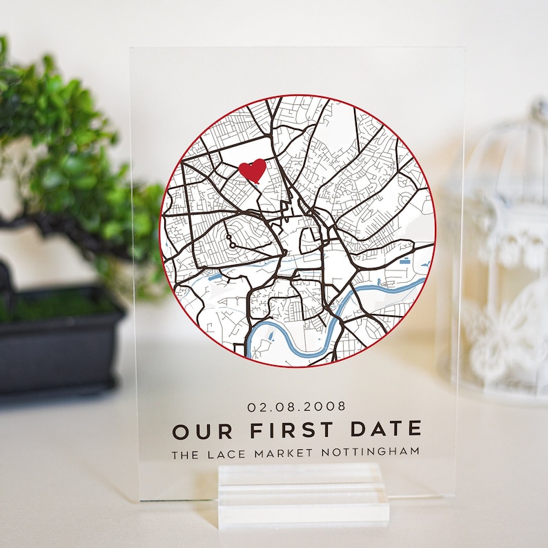 May include: A clear acrylic sign with a map of Nottingham, England, featuring a red heart marking a location. The text "02.08.2008 OUR FIRST DATE THE LACE MARKET NOTTINGHAM" is printed below the map.