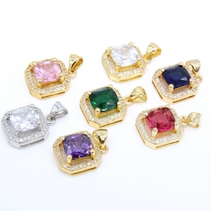 May include: Seven gold pendants with square-shaped gemstones in various colors, including pink, white, green, blue, red, and purple. Each pendant has a gold chain and a clear crystal halo around the gemstone.