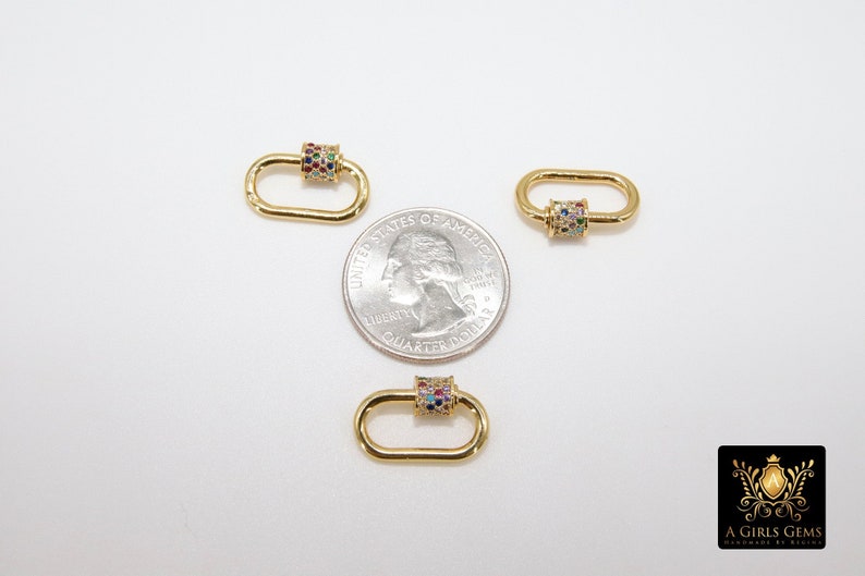 May include: Three gold-toned oval-shaped clasps with a colorful, multi-faceted stone design. Each clasp is approximately the size of a US quarter.