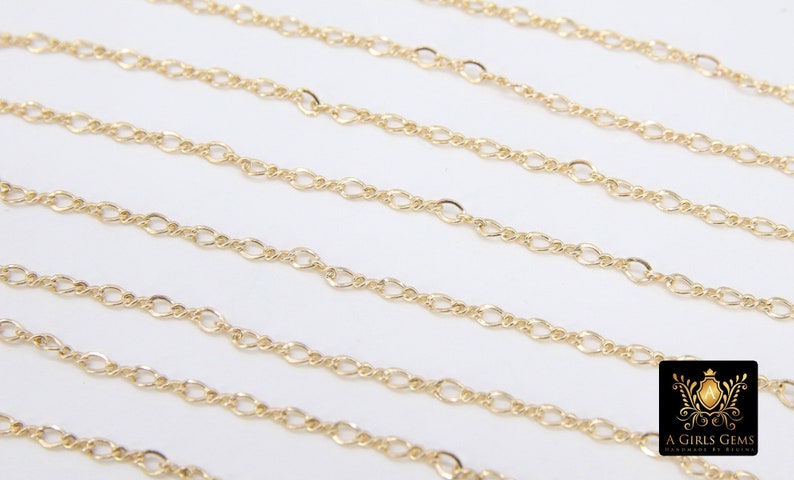 May include: Multiple strands of gold chain, a delicate, oval-link chain, perfect for jewelry making.