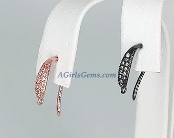 May include: Two pairs of earring hooks with a curved design. One pair is rose gold with clear cubic zirconia stones and the other pair is black with clear cubic zirconia stones. The earring hooks are displayed on a white stand. AGirlsGems.com is printed on the stand.