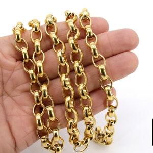 May include: A gold chain necklace with a thick, round link design. The chain is laid out on a hand, showing the length and detail of the links.