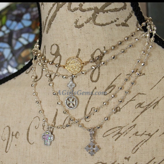 18-Inch Rhodium Plated Necklace with 4mm Sterling Silver Beads and Sterling Silver Saint Christopher Charm.