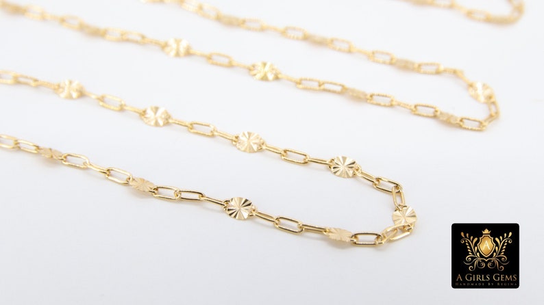 May include: A gold chain necklace with a delicate, patterned design. The chain features small, round links with a textured surface.