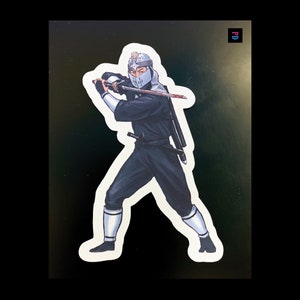 Sticker personnage Man From Japan Versions 1 et 2 - Résistant aux intempéries, mat/brillant coupe baiser - 3 tailles
