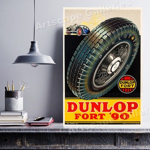 May include: Vintage poster advertising Dunlop Fort '90 tires. The poster features a close-up of a tire with a spoke wheel, a small car in the background, and the text "Dunlop Fort '90".