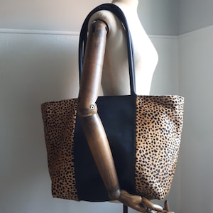 Black leather shopper with hair on hide in leopard print - Bold & Stylish.