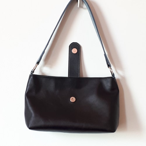 Shops Black and blue leather shoulder bag.