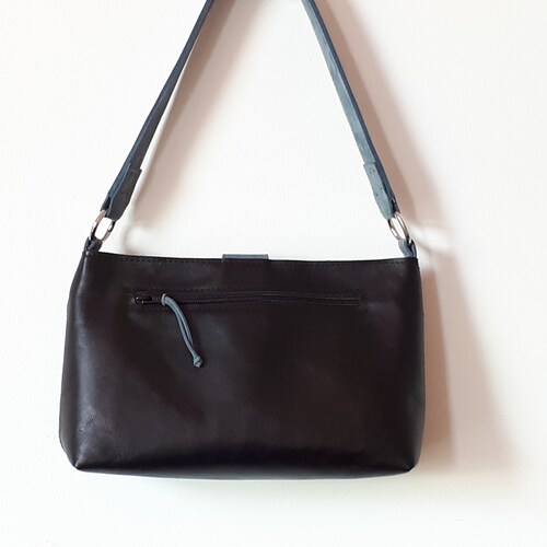 Shops Black and blue leather shoulder bag.