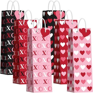 May include: Set of six Valentine's Day gift bags with different patterns. The bags are pink, red, and black with hearts and XOXO designs.