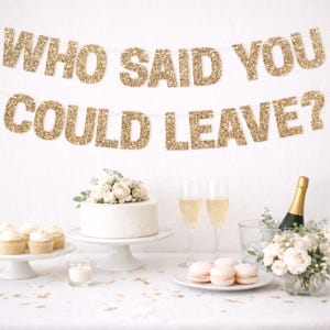Gold glitter "WHO SAID YOU COULD LEAVE?" retirement banner for retirement party decorations.