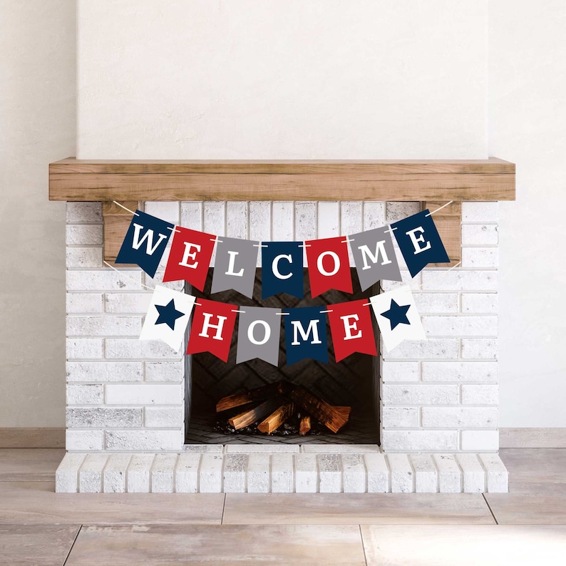 A red, white, and blue welcome home banner with white stars hanging above a fireplace.