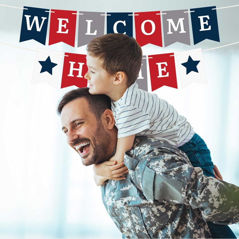 A father in military uniform is giving his son a piggyback ride. The son is smiling and has his arms around his father's neck. A banner above them reads "WELCOME HOME".