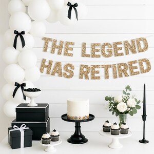 Gold glitter "The Legend Has Retired" retirement banner for retirement party decorations.