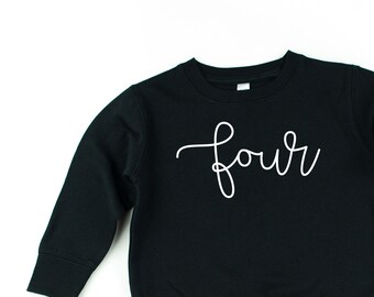 May include: Black sweatshirt with white cursive writing that says "four" on the front.